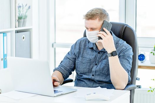 Handsome man teleworking at home during quarantine