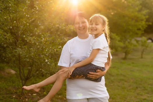 mother and daughter playing summer