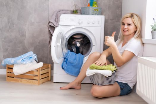 pretty smiling girl in the laundry room