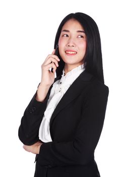 Cheerful young business woman in suit and talking on a mobile phone