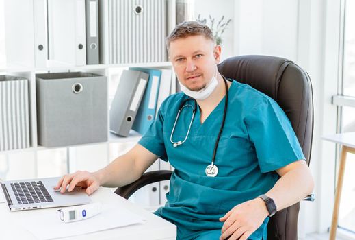Portrait of attractive doctor in uniform at clinic