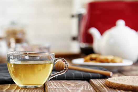 Ceramic teapot and toaster, kitchen table counter close up