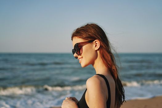 pretty woman on the beach summer vacation lifestyle sun. High quality photo