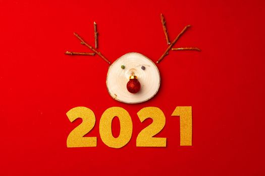 Christmas background with reindeer decoration on red top view