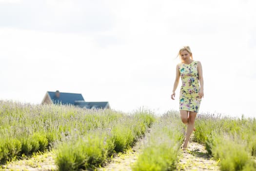 Woman standing on a lavender field