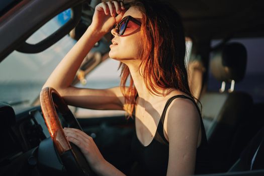 woman driving in car trip posing fashion travel. High quality photo