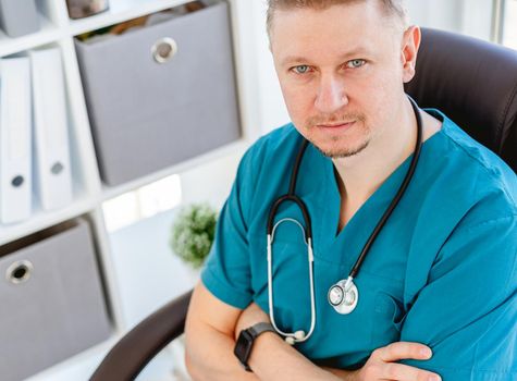 Portrait of attractive doctor in uniform at clinic