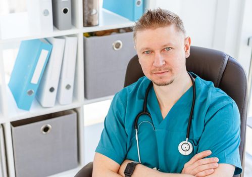 Portrait of attractive doctor in uniform at clinic