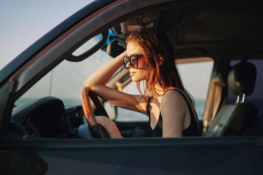 woman driving in car trip posing fashion travel. High quality photo