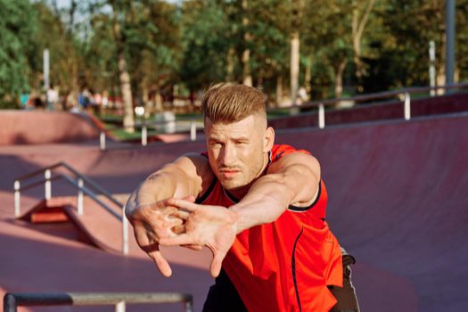 sports man on the playground in the park workout. High quality photo