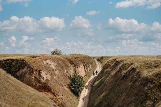 deep clay canyon overgrown with green grass