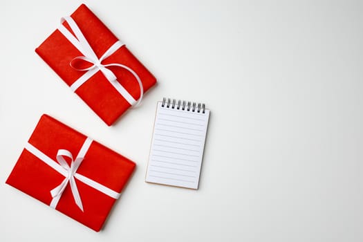 Red gift boxes on white background top view, copy space