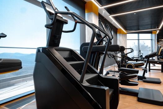 Modern gym interior with new fitness equipment, no people