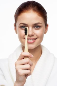 cheerful woman in white coat toothbrush dental health hygiene. High quality photo