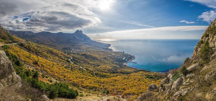 Mountain, covered with clouds against the blue sea. The picturesque bay of Laspi, Crimea seascape in autumn. seascape coast, panoramic view, Laspinsky pass. Travel, relax or loneliness concept