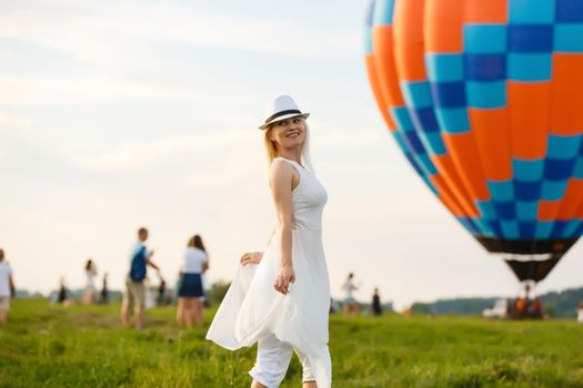 Amazing view with woman and air balloon. Artistic picture. Beauty world. The feeling of complete freedom