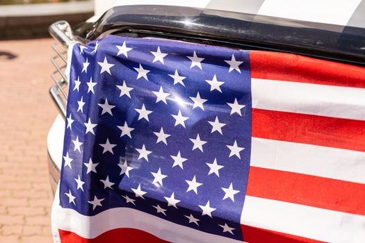US flag on car trunk