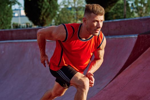 man doing exercises outdoors in the park. High quality photo