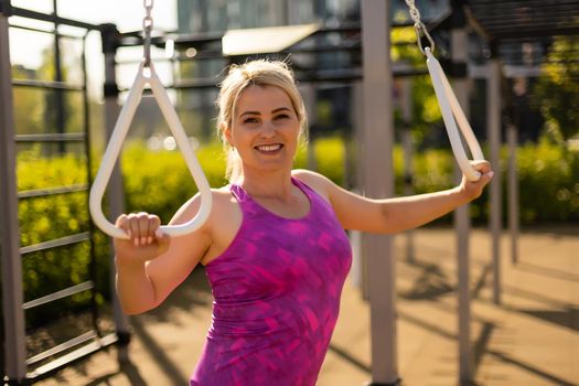 fitness woman doing situps in outdoor gym woking out strength training