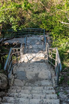 Stone staircase after renovation on the trail leading from St. George Monastery to Jasper Beach, Cape Fiolent, Crimea Russia. Famous 800 steps to the beach. The concept of healthy and active travel