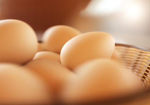 Brown eggs in the basket on white. 3D rendering illustration.