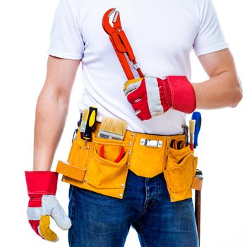 worker with tools belt holding
