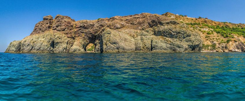 Amazing colorful sunset on the beach. Beautiful sea landscape. Diana's grotto in Sevastopol. Fiolent, Sevastopol, Crimea.