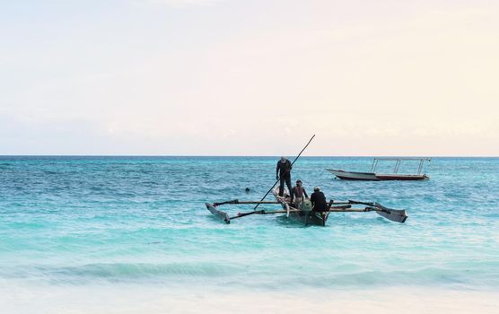 beautiful colorful seascape with fishing boats and fishermen, Zanzibar