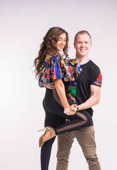 Beauty couple dancing social dance. Kizomba or bachata or semba or taraxia , on white background.