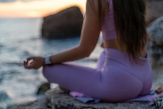 Young woman practicing yoga outdoors. Harmony and meditation concept. Healthy lifestyle.