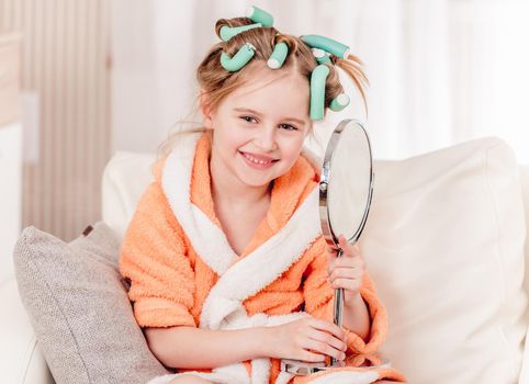 Adorable kid is happy about her new hair style