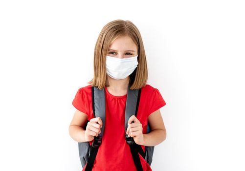 School girl in medical face mask on white background