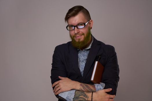 business man with glasses with tattoos on his arms office professionals. High quality photo