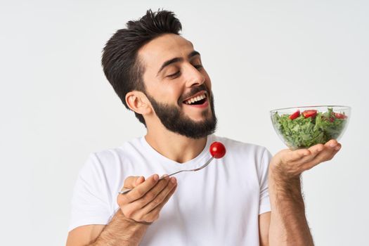 bearded man plate with vegetable salad eating health. High quality photo