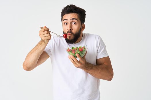 bearded man plate with vegetable salad eating health. High quality photo