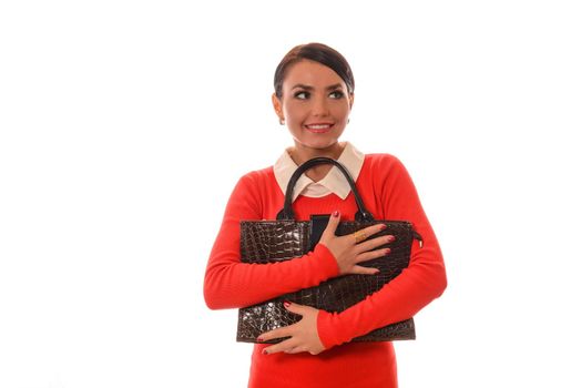 woman in a red dress with a brown bag standing on white background