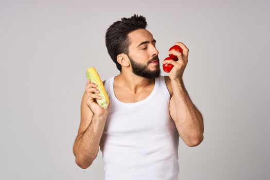 a man in a white t-shirt diet diet lifestyle health strength light background. High quality photo
