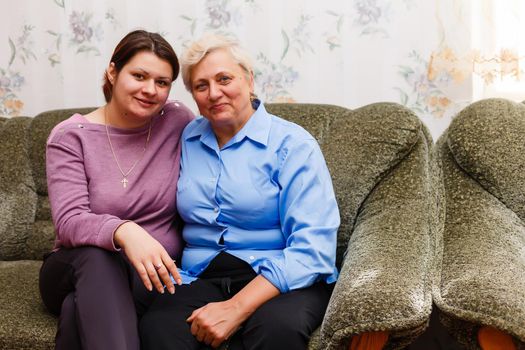 pretty woman and senior mother at home