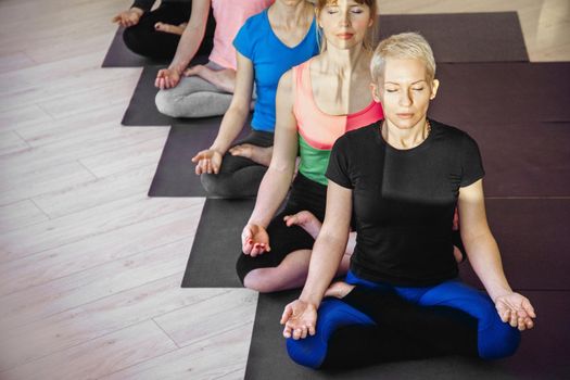 Beautiful lotus position in yoga classes for women