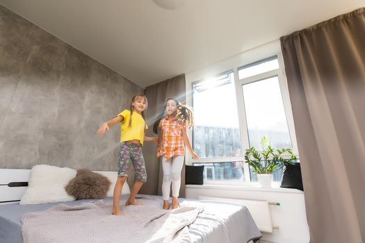 Creative cute girls, two sisters at home