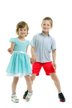 Boy and girl, brother and sister posing in the studio. Concept of family values, friendship, game. Isolated on white background