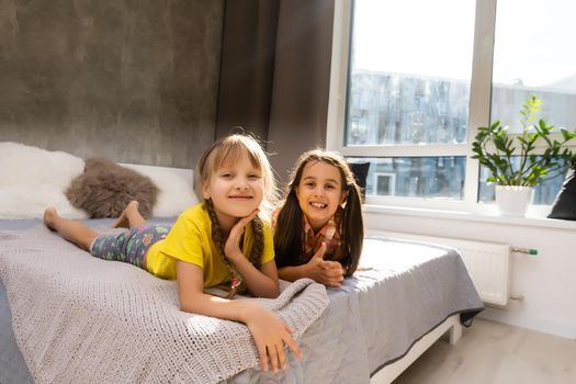 Creative cute girls, two sisters at home