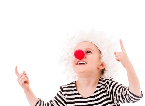 Happy smiling girl in white wig and funny red nose pointing up isolated on whitw background