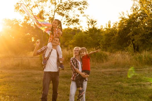 Happy family on sunset in nature