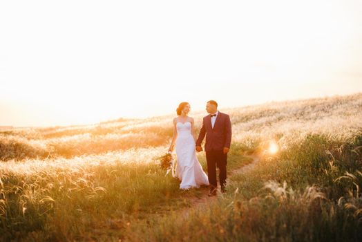 A couple in love a guy and a girl on a walk in the forest belt