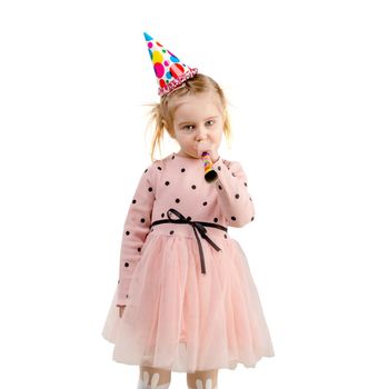 girl wearing birthday cap, dressed in pink with polkadot, lovely hair, isolated on white background
