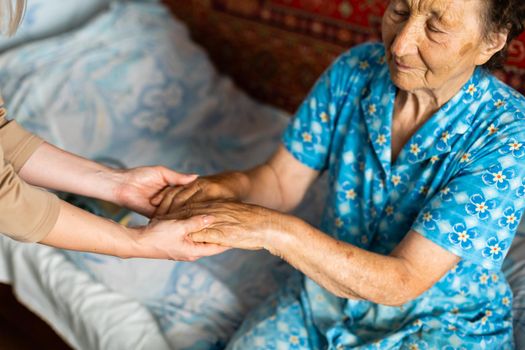 Senior woman with her home caregiver