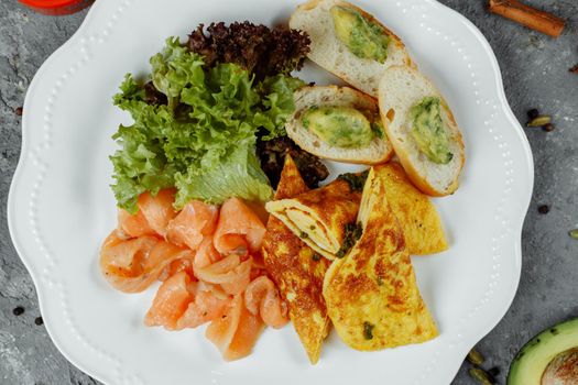 omelet with red fish and vegetables, beautiful serving.