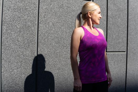 Sport woman doing stretching exercise during outdoor cross training workout