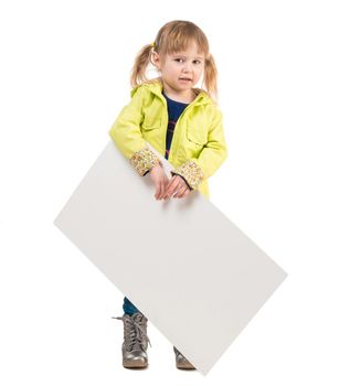 cute little girl in yellow coat with blank sheet in hands isolated on white background